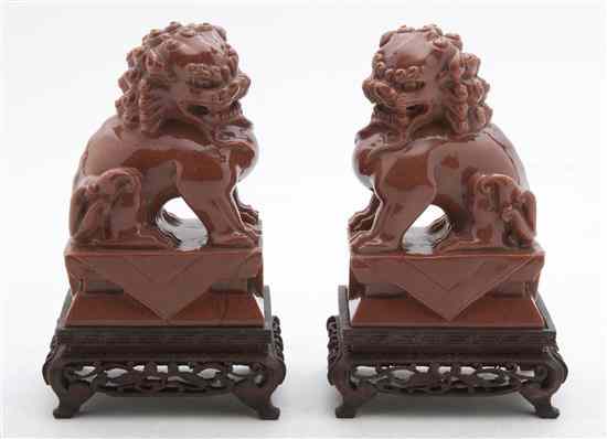 Appraisal: A Pair of Carved Gold Stone Fu Dogs the animals