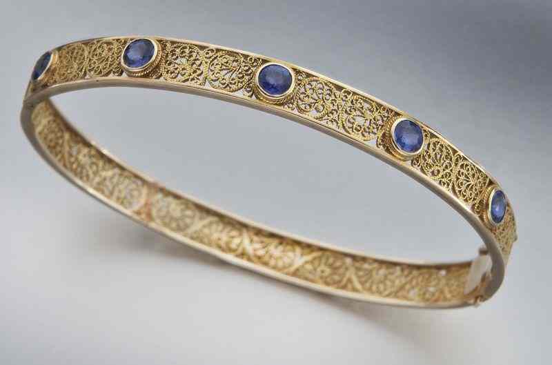 Appraisal: Retro K gold and sapphire filigree braceletfeaturing five round brilliant