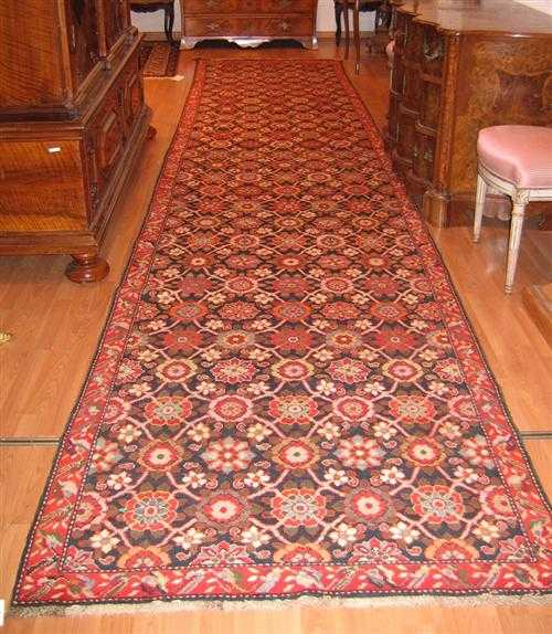 Appraisal: KARABACH runner old Blue central field patterned throughout with colourful