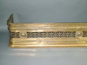 Appraisal: A Georgian style gilt brass fire curb with pierced decoration