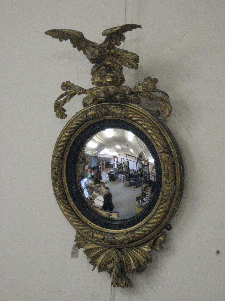 Appraisal: A REGENCY CARVED AND GILT GESSO CONVEX WALL MIRROR the