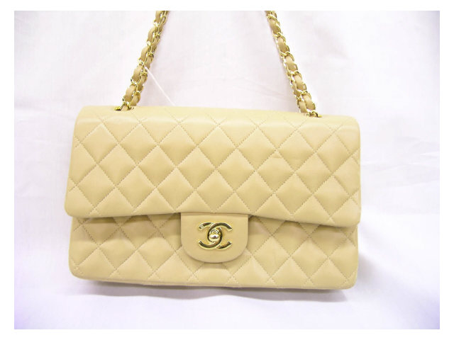 Appraisal: Chanel handbag quilted camel leather leather and gold chain strap