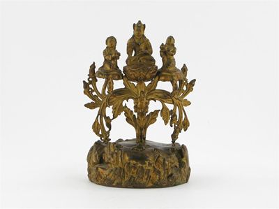 Appraisal: A rare Tibetan gilt bronze group with the central figure