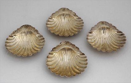 Appraisal: SET OF FOUR GEORGE III ARMORIAL SILVER SHELL-FORM BUTTER DISHES