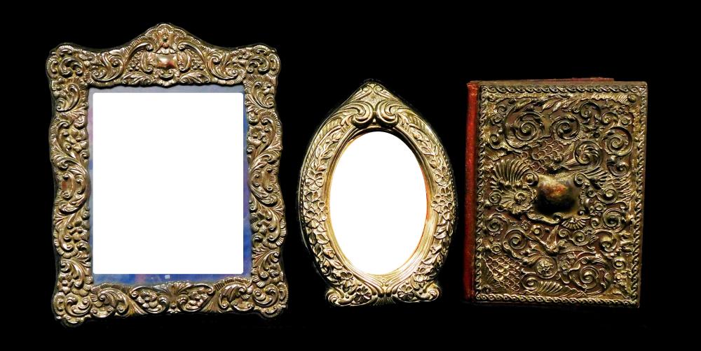 Appraisal: SILVER-PLATE Three pieces of ornate repousse silver-plate two frames and