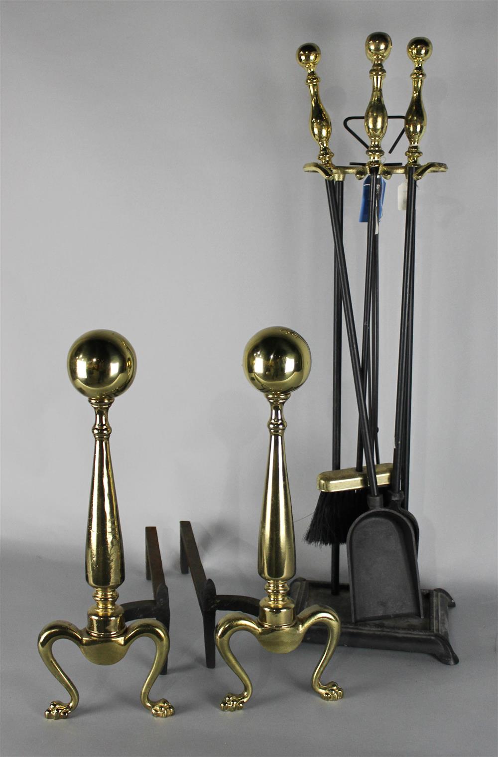 Appraisal: PAIR OF CANNONBALL ANDIRONS TOGETHER WITH THREE-PIECE BRASS TOPPED FIRE