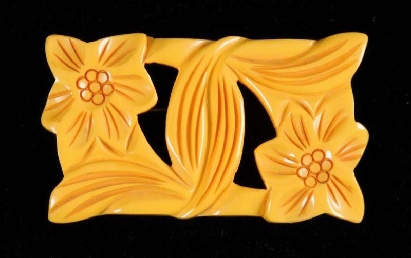 Appraisal: Bakelite Cream Colored Floral Reticulated Pin Condition Near Mint Size