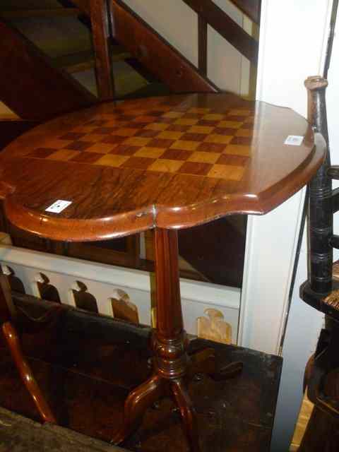 Appraisal: A LATE VICTORIAN WALNUT GAMES TABLE with inlaid chequered board