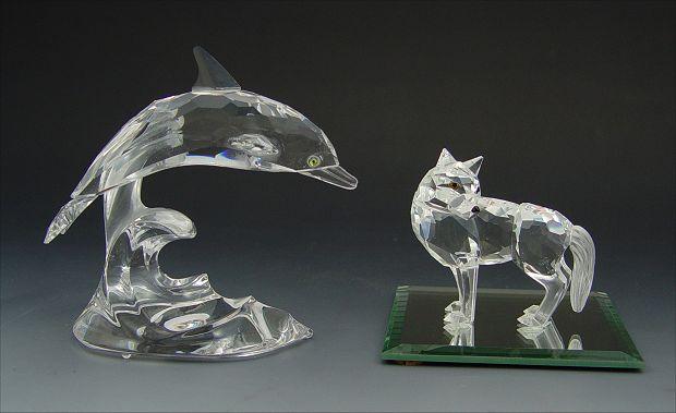 Appraisal: SWAROVSKI CRYSTAL FIGURES DOLPHIN WOLF Part of the South Sea