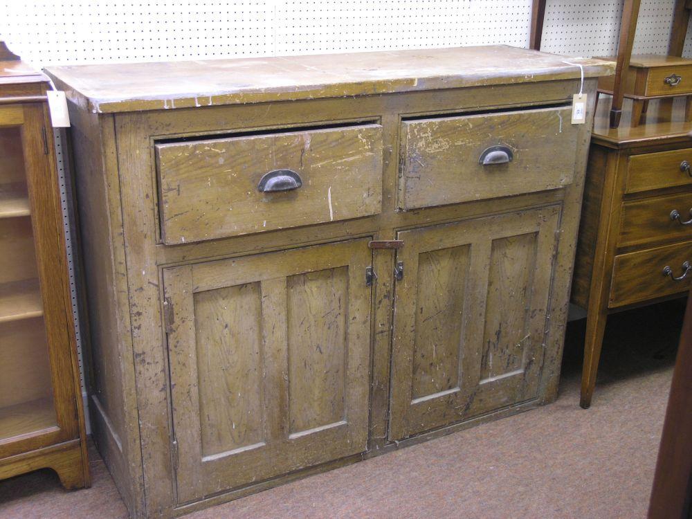 Appraisal: A Victorian grained pine side cupboard fitted with two drawers