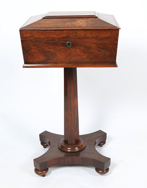 Appraisal: A VICTORIAN ROSEWOOD TEAPOY the upper section of sarcophagus form