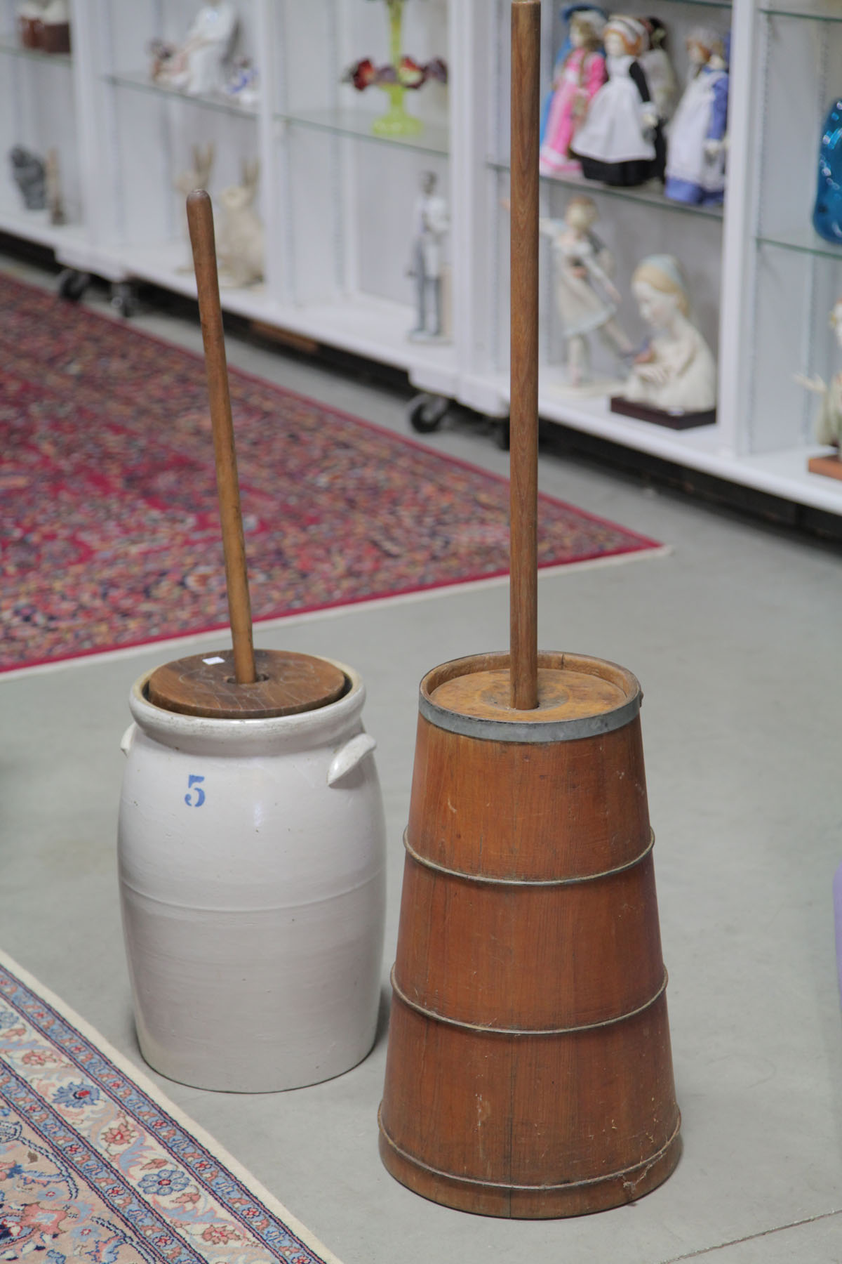 Appraisal: TWO BUTTER CHURNS American early th century Wood stave construction