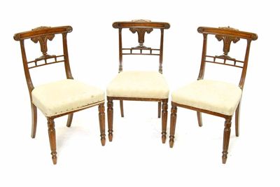 Appraisal: Three Regency carved rosewood side chairs each with a curved