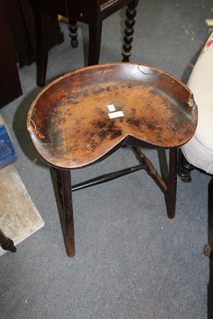 Appraisal: TWO TH CENTURY MILKING STOOLS a th Century Chippendale style