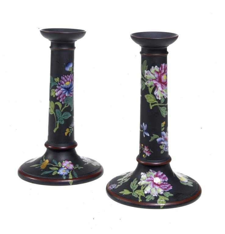 Appraisal: A PAIR OF WEDGWOOD BLACK BASALT PILLAR CANDLESTICKS enamelled with