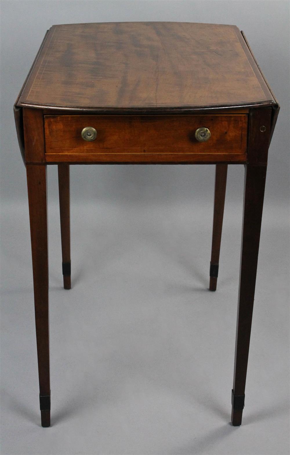 Appraisal: REGENCY CROSS-BANDED MAHOGANY PEMBROKE TABLE the rounded rectangular top flanked