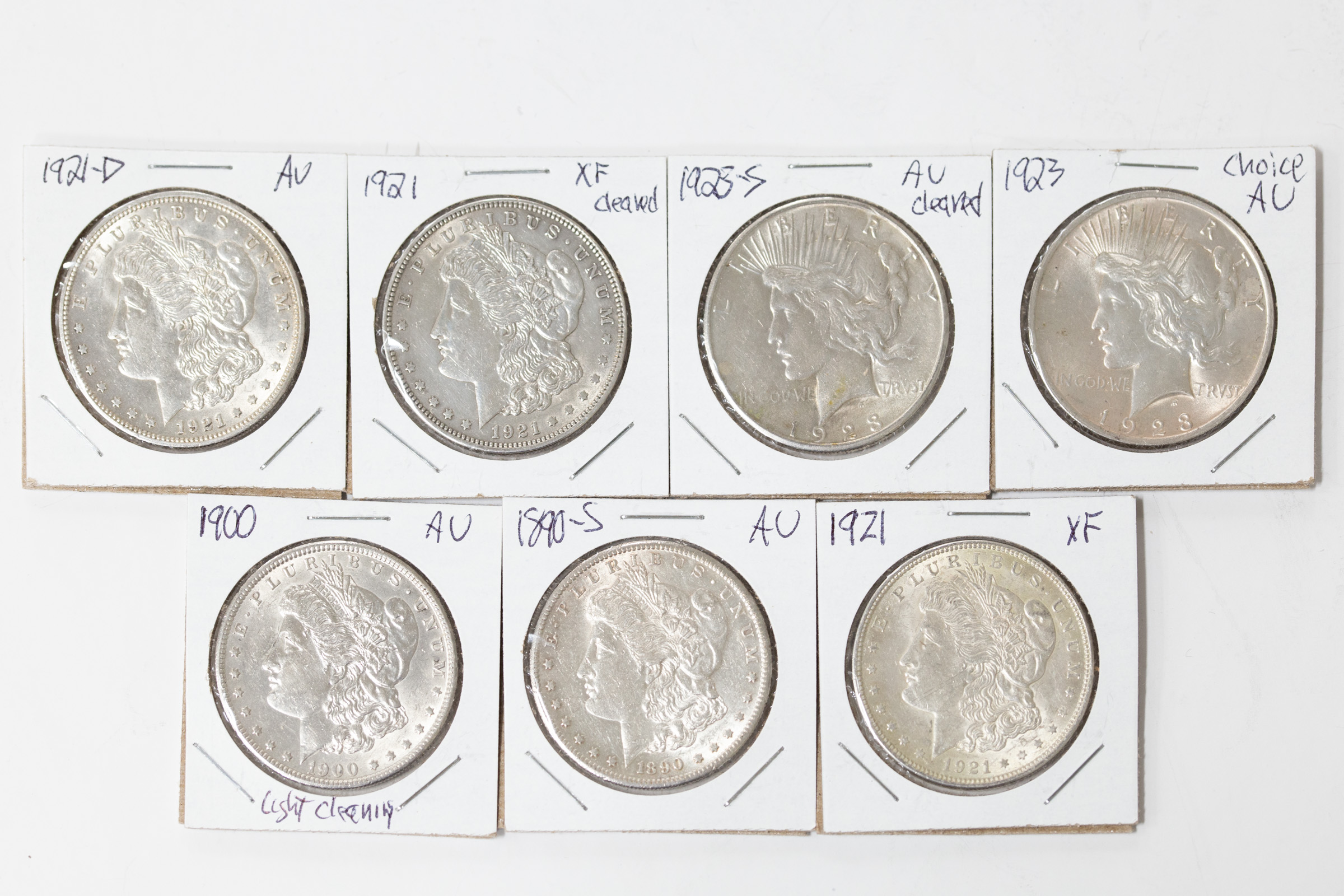 Appraisal: SEVEN US SILVER DOLLARS -S AU Choice AU light cleaning