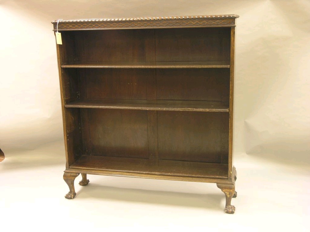 Appraisal: A George V mahogany open bookcase gadrooned top above three