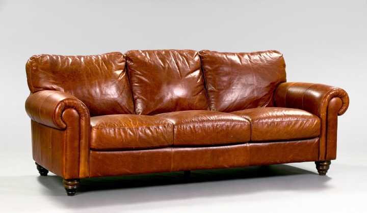 Appraisal: Large English Overstuffed Brown Leather Sofa the lightly distressed leather