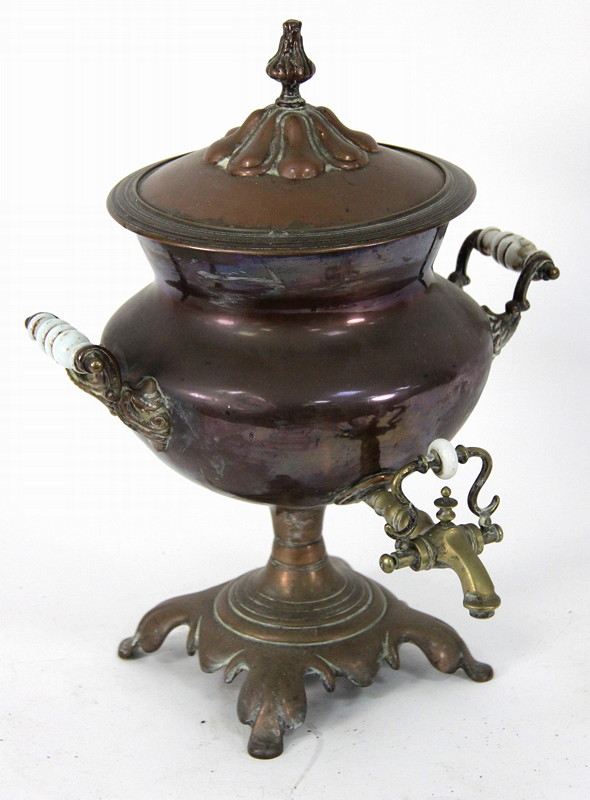 Appraisal: A copper tea urn with brass top and opaque glass