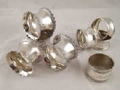 Appraisal: A set of four white metal tests silver napkin rings