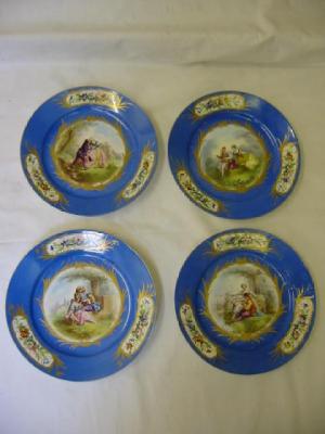 Appraisal: A SET OF FOUR SEVRES PORCELAIN PLATES painted with panels