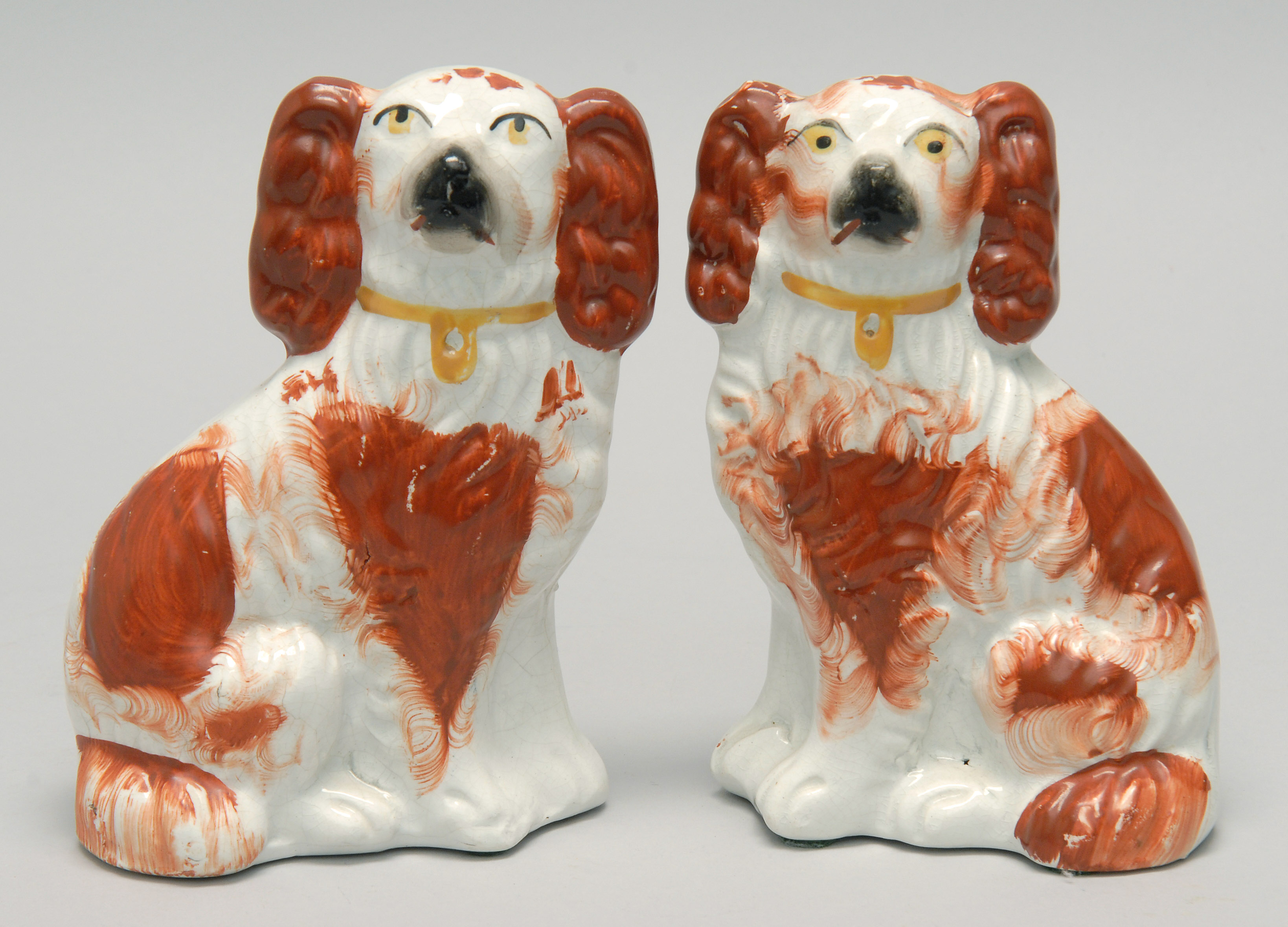 Appraisal: PAIR OF TH CENTURY STAFFORDSHIRE DOGS in red and white