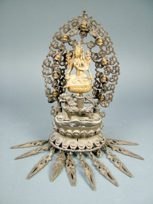 Appraisal: A Sino-Tibetan bronze and gilt bronze finial possibly depicting Maitreya