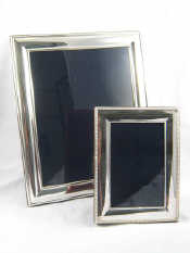 Appraisal: Two silver plated photo frames with strut backs one x