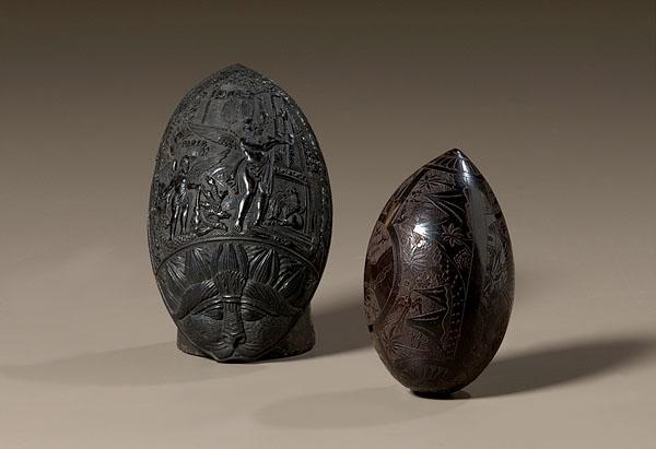 Appraisal: CARVED COCONUTS WITH AMERICAN AND FRENCH MOTIFS th century A