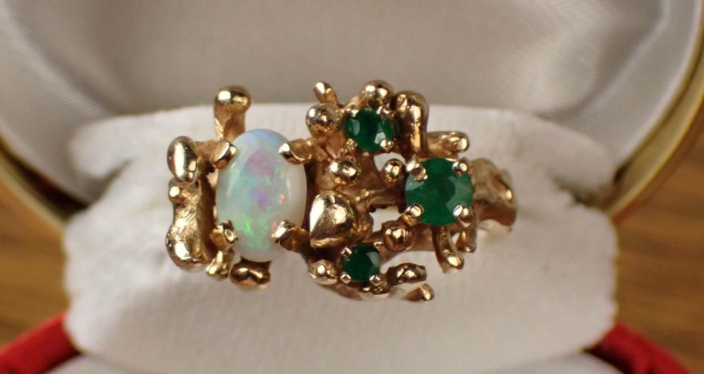 Appraisal: OPAL EMERALD AND FOURTEEN KARAT GOLD RING set with an