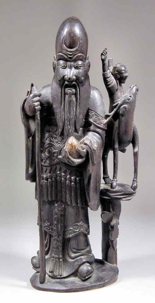 Appraisal: A Chinese root carving of a standing sage with a