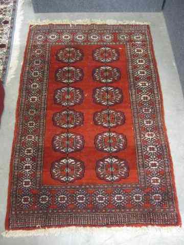 Appraisal: Belouchi Handmade Rug indigo ivory designs on red field '