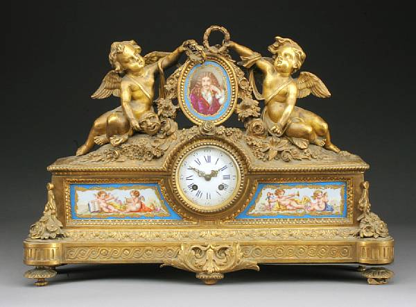 Appraisal: A Louis XV style porcelain mounted gilt bronze mantel clock