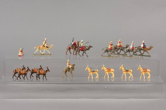 Appraisal: Lot of metal pack mules together with camels with riders