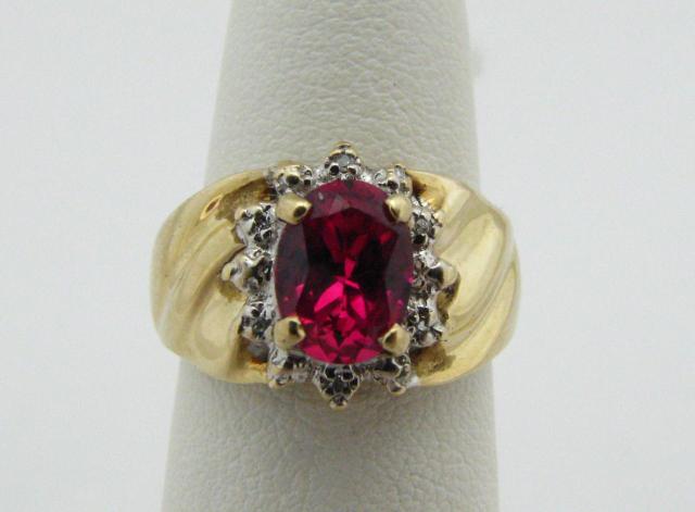 Appraisal: K Yellow gold ring with oval red stone dwt