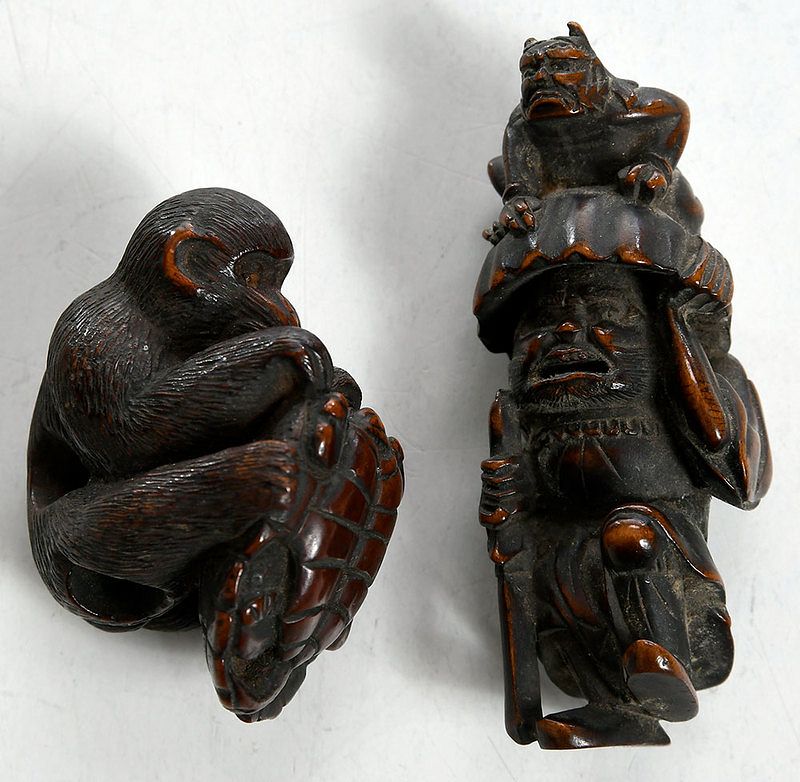 Appraisal: Two Japanese Carved Wood Netsuke Figures Meiji period figure of