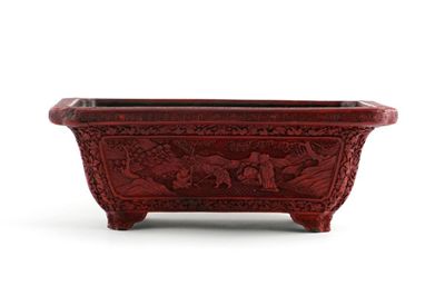 Appraisal: A Chinese red cinnabar lacquer rectangular jardini re carved with