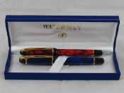 Appraisal: A blue marble effect Waterman fountain pen and a red