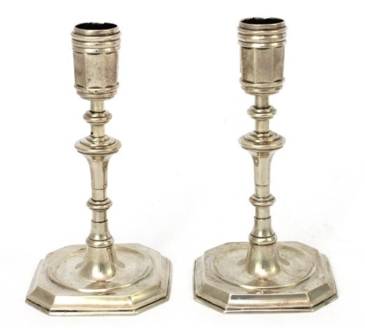 Appraisal: A pair of Victorian silver candlesticks each in a stylized