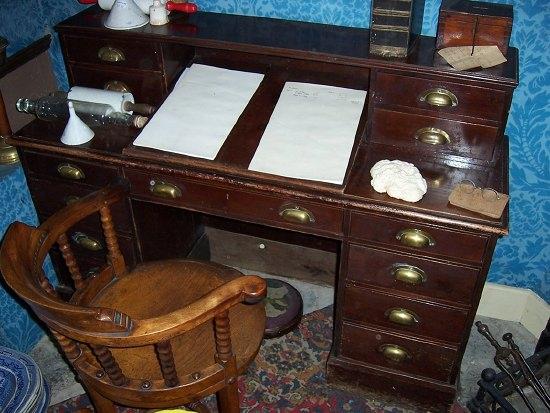 Appraisal: An early th Century stained pine pedestal desk the superstructure