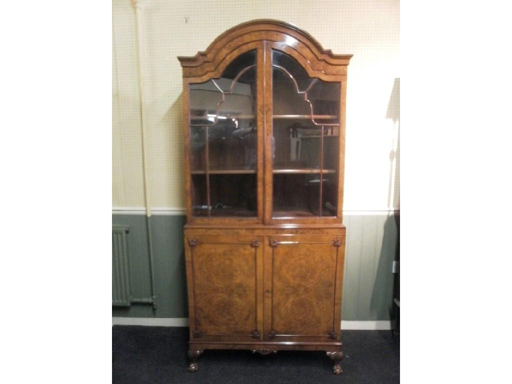 Appraisal: A burr walnut display cabinet the arched top with two