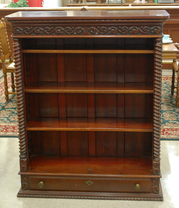 Appraisal: CARVED MAHOGANY BOOKCASE American c having four adjustable open shelves