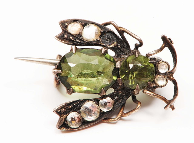 Appraisal: A brooch in the form of winged insectwith green and