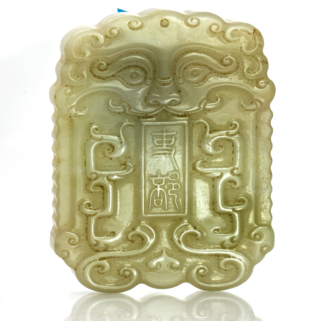 Appraisal: CHINESE CELADON JADE TAOTIE MASK PLAQUE Chinese celadon jade Taotie