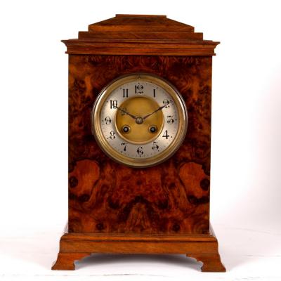 Appraisal: A walnut cased bracket clock the silver chapter ring with