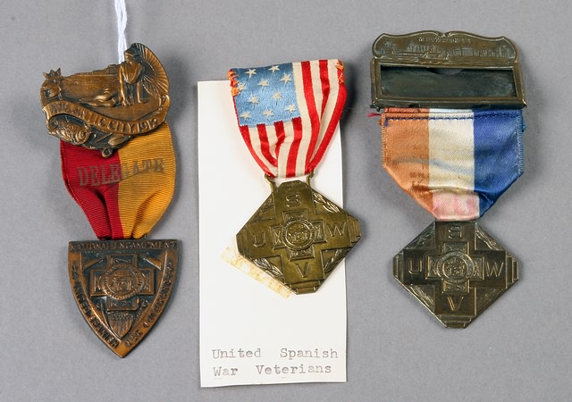 Appraisal: USWV National encampment Badges from from one with faded ribbon