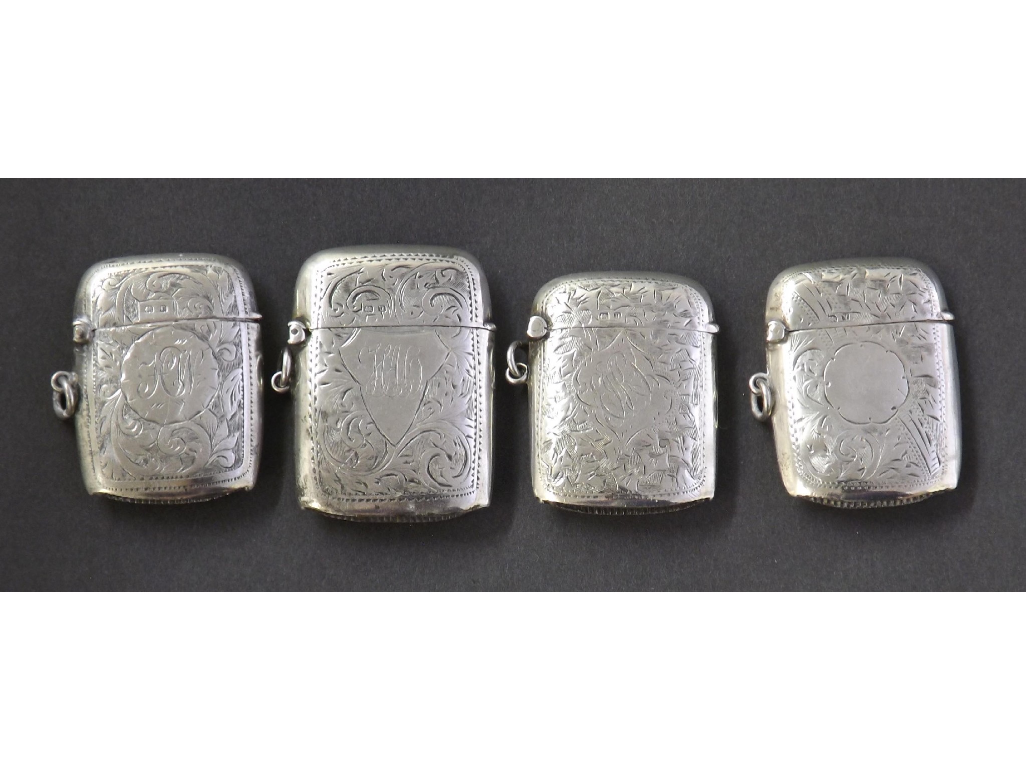 Appraisal: Four th century and later silver vesta cases each engraved