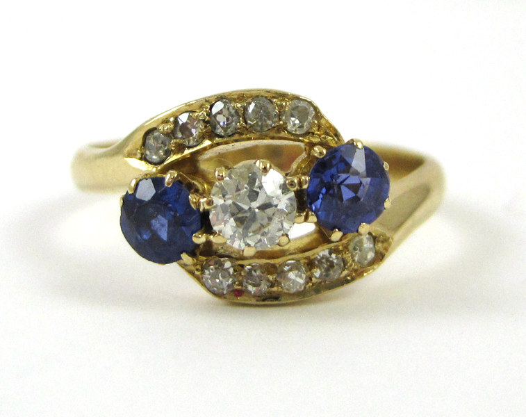 Appraisal: TANZANITE DIAMOND AND EIGHTEEN KARAT GOLD RING set with two