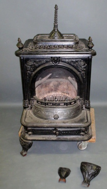 Appraisal: Cast iron parlor stove Fireside h x w x d